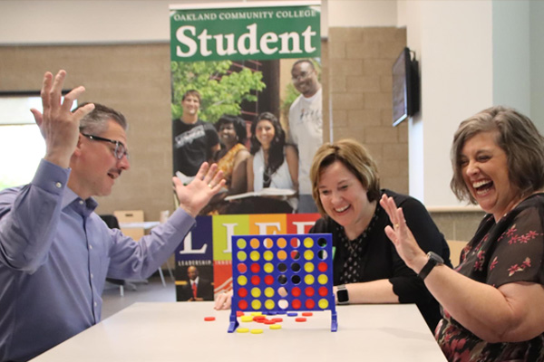 Chancellor playing game with students
