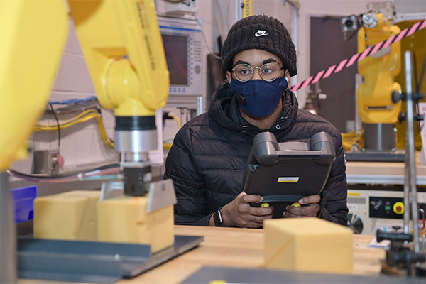 OCC Technology Student working on equipment