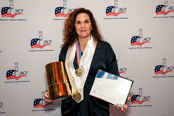 Chef Julie Selonke holds awards from American Culinary Federation