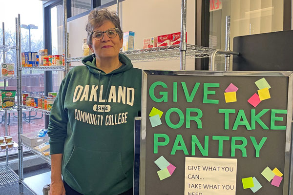 Brenda Lowery, OCC student engagement coordinator, in front of the Give or Take food pantry.