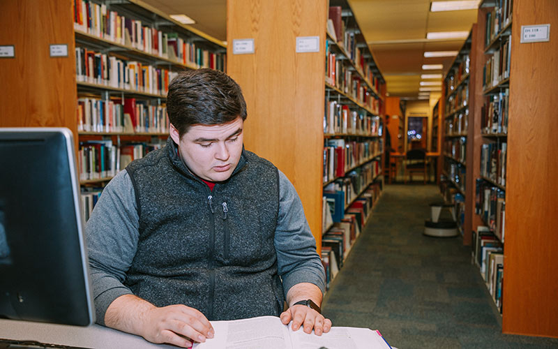 A student in the library. 