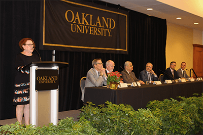 OU, OCC and MCC Executives pose for a photo. 